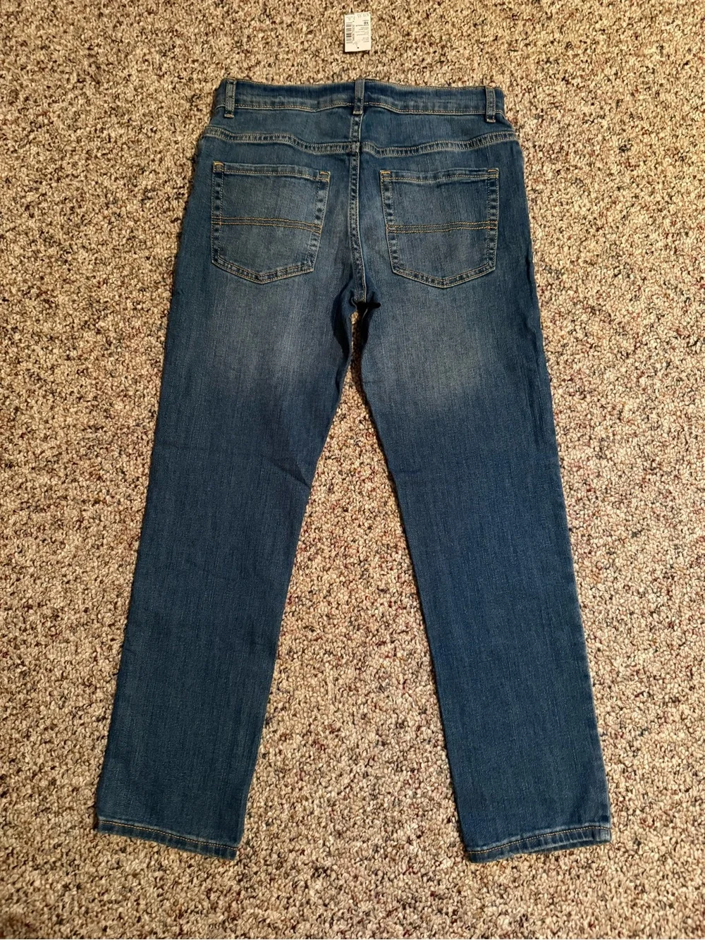 The Children's Place Boys' Stretch skinny jeans in a blue 10 Husky